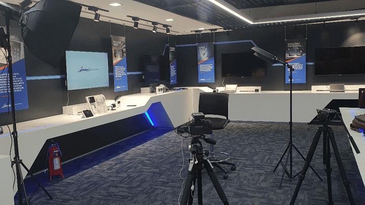 Corporate video maker preparing for a corporate promotional video shoot